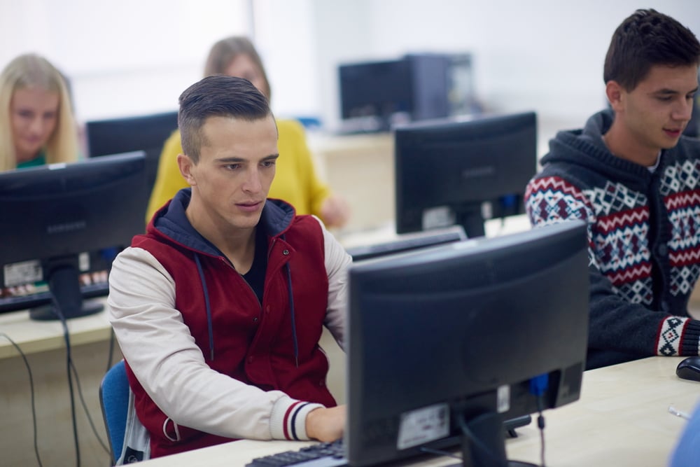 technology students group in computer lab classroom